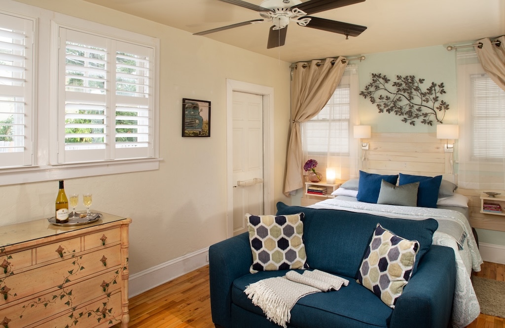 Enjoy the best St. Augustine Lodging at our bed and breakfast. Featuring a king size bed and blue love seat, this room could be yours.